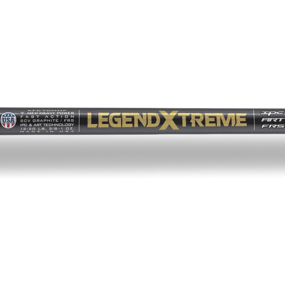 Close-up of the St. Croix Legend Xtreme 7'4" Heavy Casting Rod by americanlegacyfishing, featuring the "Legend Xtreme" label. It offers Heavy capabilities, Advanced Reinforcing Technology, premium SCVI graphite, and is made in the USA with a sleek black design accented by gold and silver details.