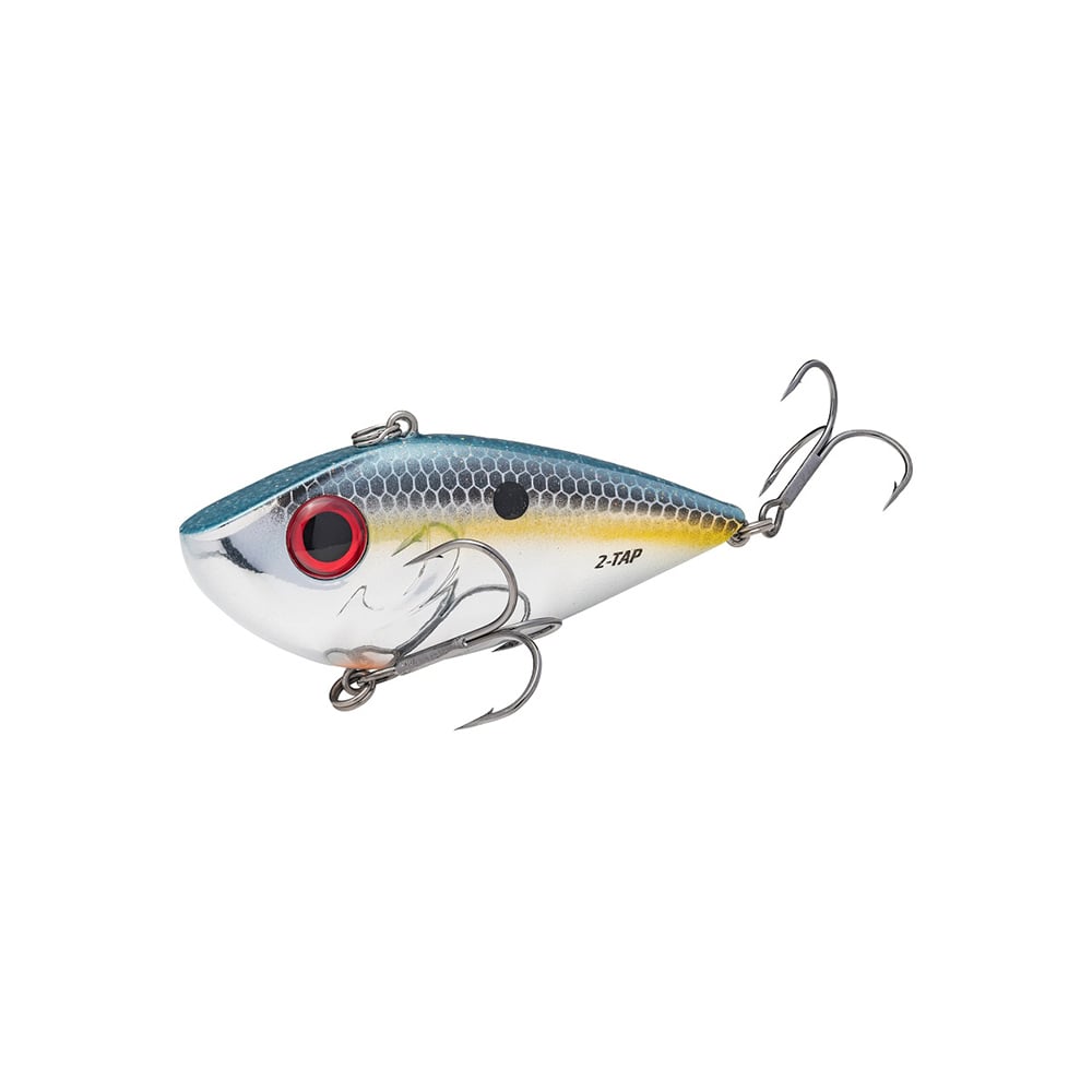 Introducing the Strike King Red Eye Shad Tungsten 2 Tap, a lifelike lipless crankbait featuring metallic scales, a blue back, yellow stripe, and striking red eye. It comes with two treble hooks at the belly and tail, making it perfect for catching your next big fish.