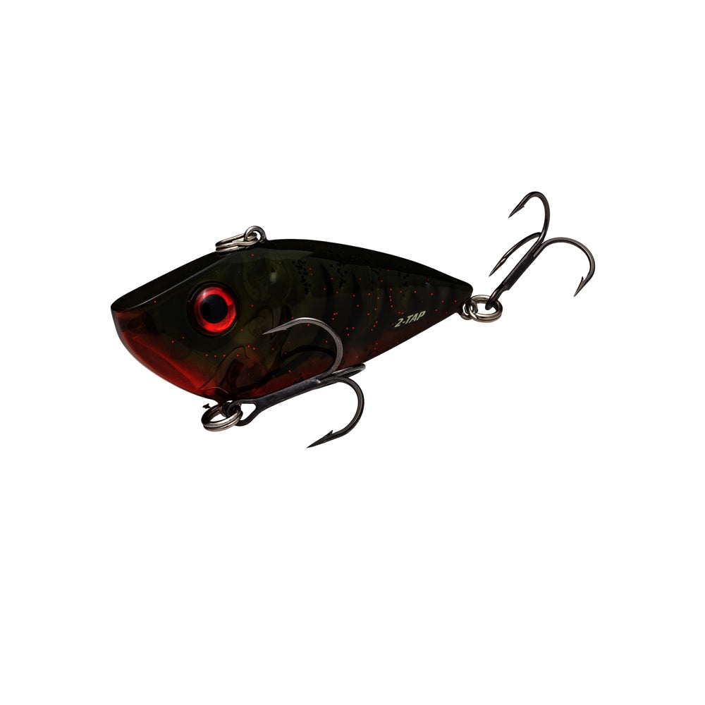 The Strike King Red Eye Shad Tungsten 2 Tap is a dark fish-shaped lipless crankbait with bold red eyes, two treble hooks, and a tungsten sound chamber for extra fish attraction.