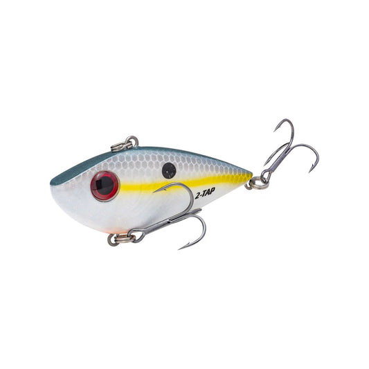 The Strike King Red Eye Shad Tungsten 2 Tap lipless crankbait features a fish-like design with a gray top, white belly, vibrant yellow stripe, striking red eye pattern, and two treble hooks, making it perfect for enticing catches.