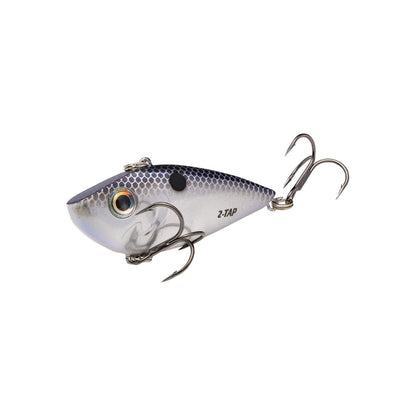 The Strike King Red Eye Shad Tungsten 2 Tap is a lipless crankbait crafted for anglers, featuring a fish-like design with a metallic blue and silver body, black spots, two treble hooks, and a realistic eye for optimal performance.