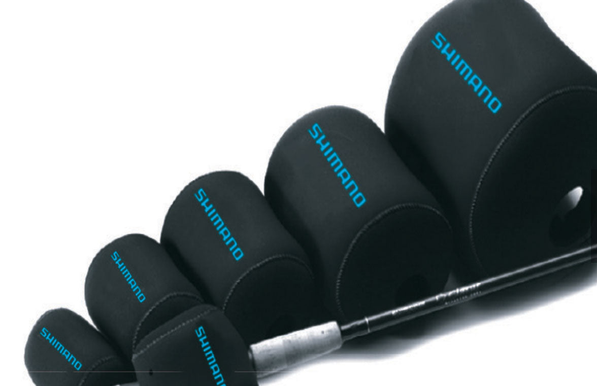 Five Shimano Neoprene Casting Reel Covers in black, arranged from smallest to largest with a fishing rod in front—perfect protection for your Shimano baitcasting reels.