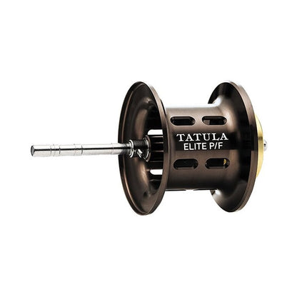 The Daiwa Tatula Elite P/F 103XS 8.1:1 Casting Reel features a sleek metallic spool design with cutouts and an extended shaft. "TATULA ELITE P/F" is prominently printed, highlighting its advanced Magforce system for excellent pitching and flipping performance.
