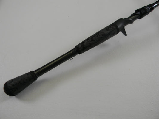 A close-up of the handle and lower section of a Temple Fork TFO Tactical Elite Bass TLE SC 747-1 7'4" Ex-Heavy Used Casting Rod in excellent condition—perfect for our Rod and Reel Trade-In Program for store credit.