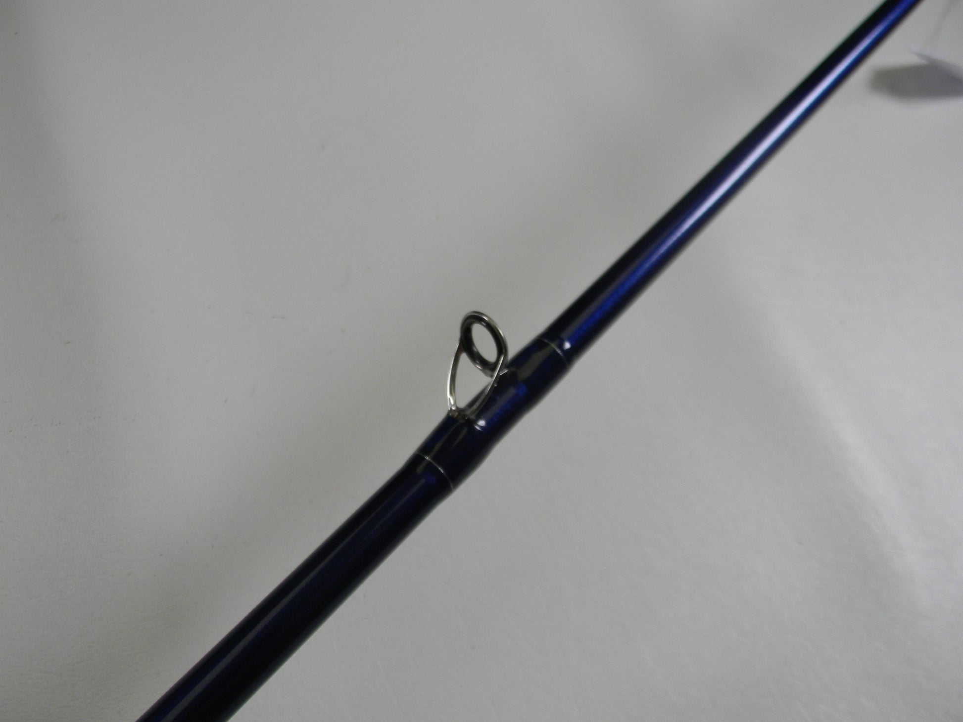 A close-up of a St. Croix Legend Tournament Bass TBC710HM Magnum Cranker 7'10" Heavy casting rod in excellent used condition, showing the metal guide ring—ideal for those trading in their gear for store credit.