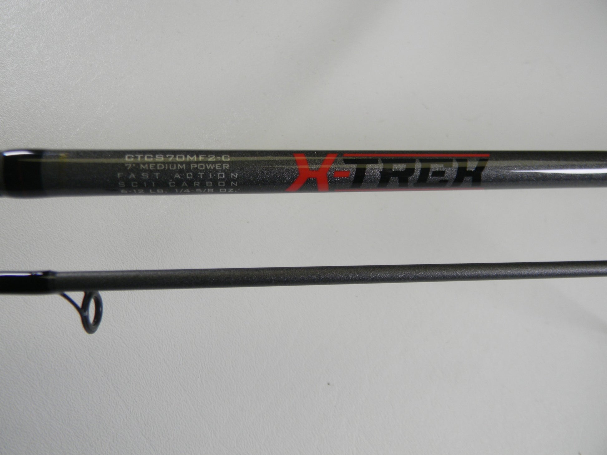 Close-up of a St. Croix X Trek CTCS70MF2-C 7'0" Medium Used Spinning Rod in excellent condition—ideal for our Rod and Reel Trade-In Program if you're upgrading your used gear.