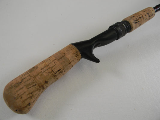 A close-up of the G. Loomis Custom Pistol Grip CR664 IM6 5'6" Heavy used casting rod in fair condition—ideal for those interested in our Rod and Reel Trade-In Program to earn store credit for your used gear.