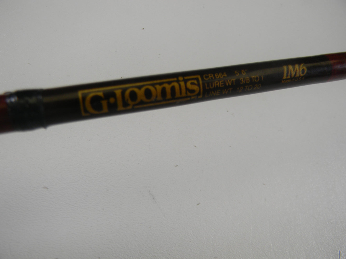 Close-up of a G. Loomis Custom Pistol Grip CR664 IM6 5'6" Heavy casting rod in fair condition. Trade in your used gear with our Rod and Reel Trade-In Program for store credit toward your next upgrade.
