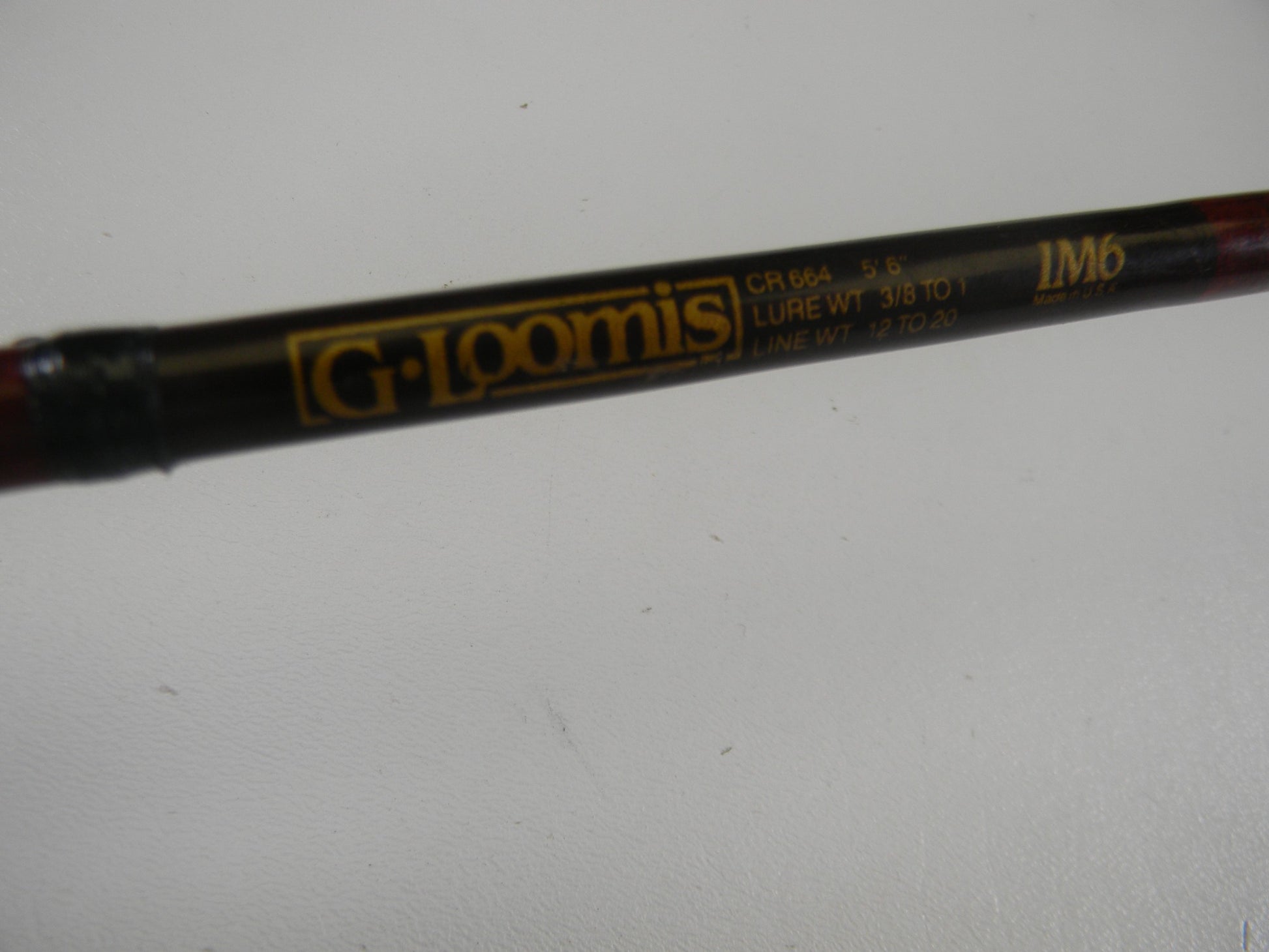 Close-up of a G. Loomis Custom Pistol Grip CR664 IM6 5'6" Heavy casting rod in fair condition. Trade in your used gear with our Rod and Reel Trade-In Program for store credit toward your next upgrade.