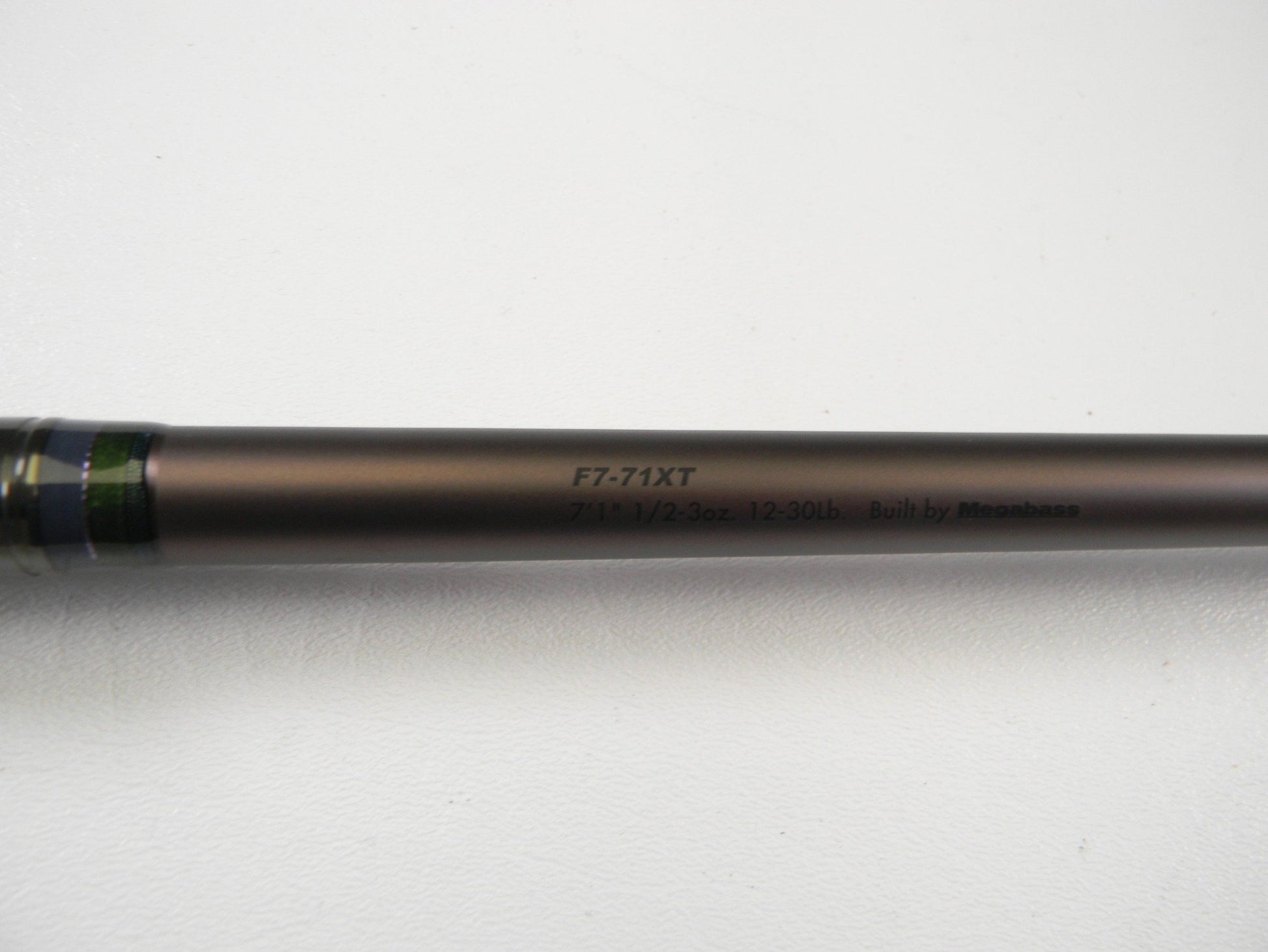 A close-up of a used Megabass Orochi X10 F7-71XT Swamp Survivor 7'1" Heavy Casting Rod in excellent condition—perfect for those seeking quality used gear or trade-in opportunities through our rod and reel program.