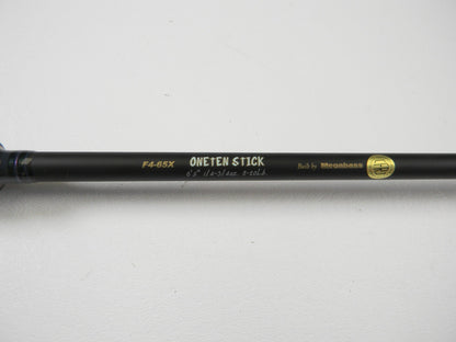Close-up of the Megabass Destroyer P5 F4-65X OneTen Stick 6'5" Medium Used Casting Rod in excellent condition—ideal for our Rod and Reel Trade-In Program or earning store credit on pre-owned Megabass gear.