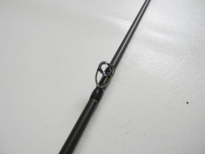 Close-up of a Megabass Destroyer P5 F4-65X OneTen Stick 6'5" Medium Used Casting Rod in excellent condition, highlighting its metal line guide—ideal for upgrading your gear or trading in with our store credit program.