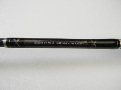 A close-up of a Daiwa Zillion ZIL731MHFB 7'3" MH used casting rod in excellent condition, displaying specs in white text on a plain background—ideal for upgrading with our Rod and Reel Trade-In Program.