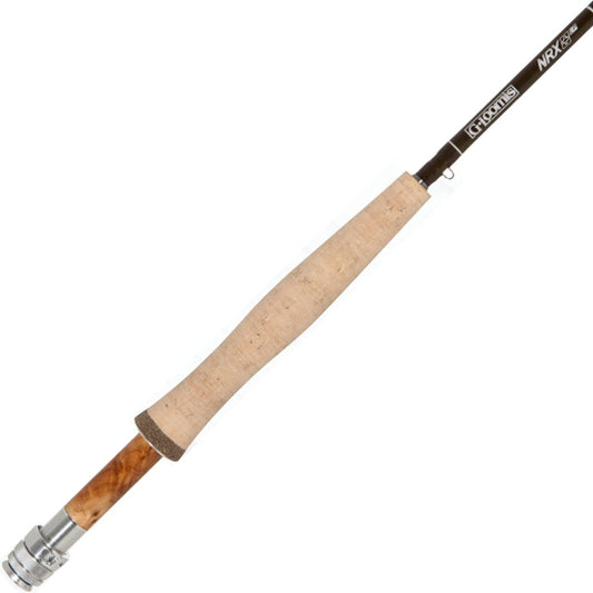 A close-up of the G. Loomis NRX+ LP 690-4 9'0" 6wt fly rod, featuring a cork handle, metal reel seat, and dark blank, designed for crisp dry fly presentation with Dynamic Recovery Technology.
