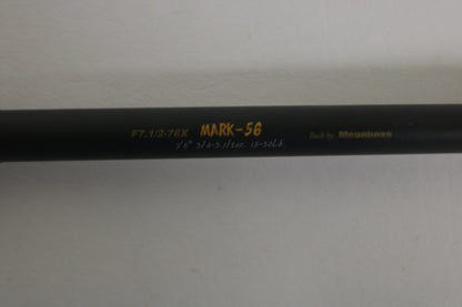 A close-up of the Megabass Destroyer P5 F7.1/2-76X Used Casting Rod, showing yellow and white model text on its black finish, with a plain light background. Brand: Megabass. Condition: Excellent.