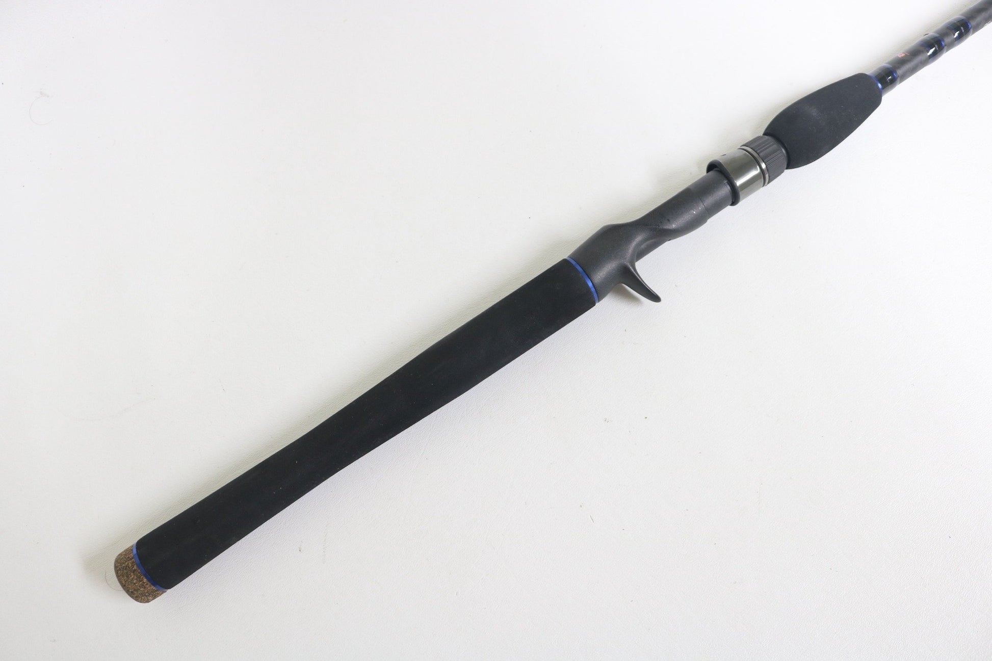 A close-up of the Dobyns Champion XP DC 795SB MT 7'9" Medium Heavy Used Casting Rod in excellent condition, featuring a black grip and trigger-style handle—ideal for buyers or participants in our used gear trade-in program.