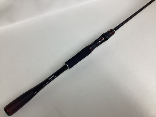 A Shimano Zodias ZDC72MLBFSA used casting rod in excellent condition, black with red accents and a foam handle, displayed diagonally on a plain white surface.