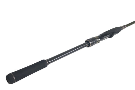 A Megabass Levante F4.5-74LVS spinning rod in excellent condition, with a foam grip handle and reel seat, lies diagonally on a white background, featuring the handle prominently in the foreground.