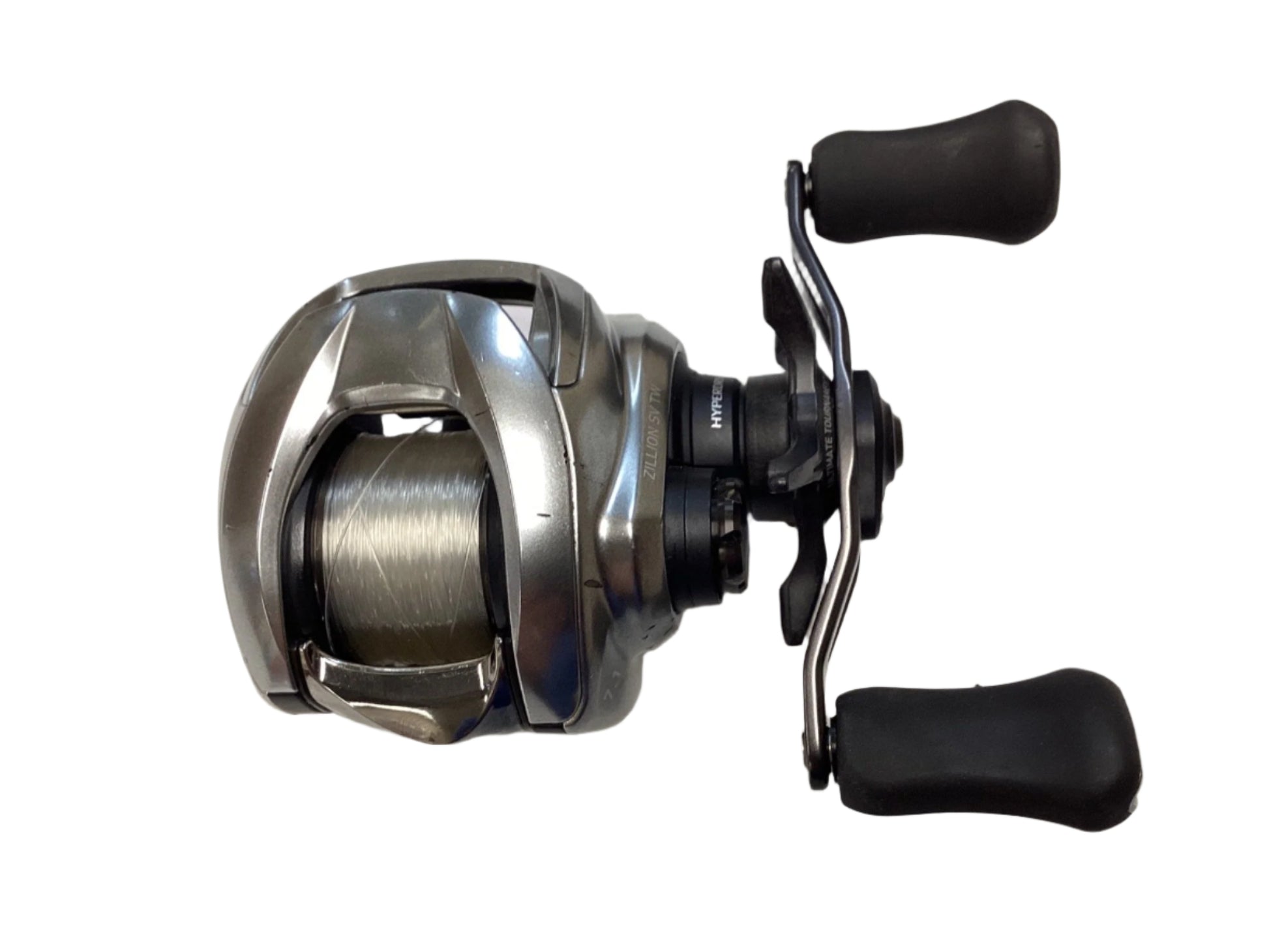 A Daiwa Zillion ZLNSVG100H used silver baitcasting reel with spool and two black handles, shown on a white background. Eligible for Rod and Reel Trade-In or used gear store credit. Brand: Daiwa.
