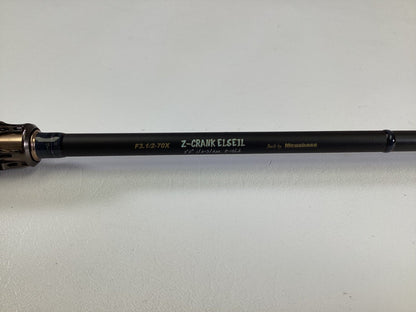 A close-up of a Megabass Destroyer P5 F3.1/2-70X Used Casting Rod in excellent condition, featuring “Exclusively Built” and “Built by Megabass” labels on a light surface.