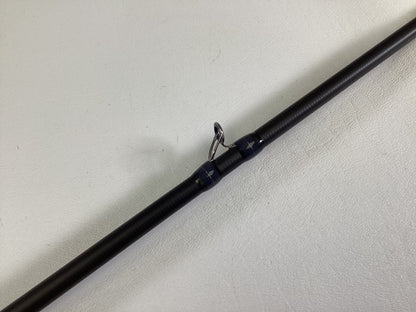 A close-up of the Megabass Destroyer P5 F3.1/2-70X Used Casting Rod in excellent condition, highlighting one of its line guides against a plain white background.