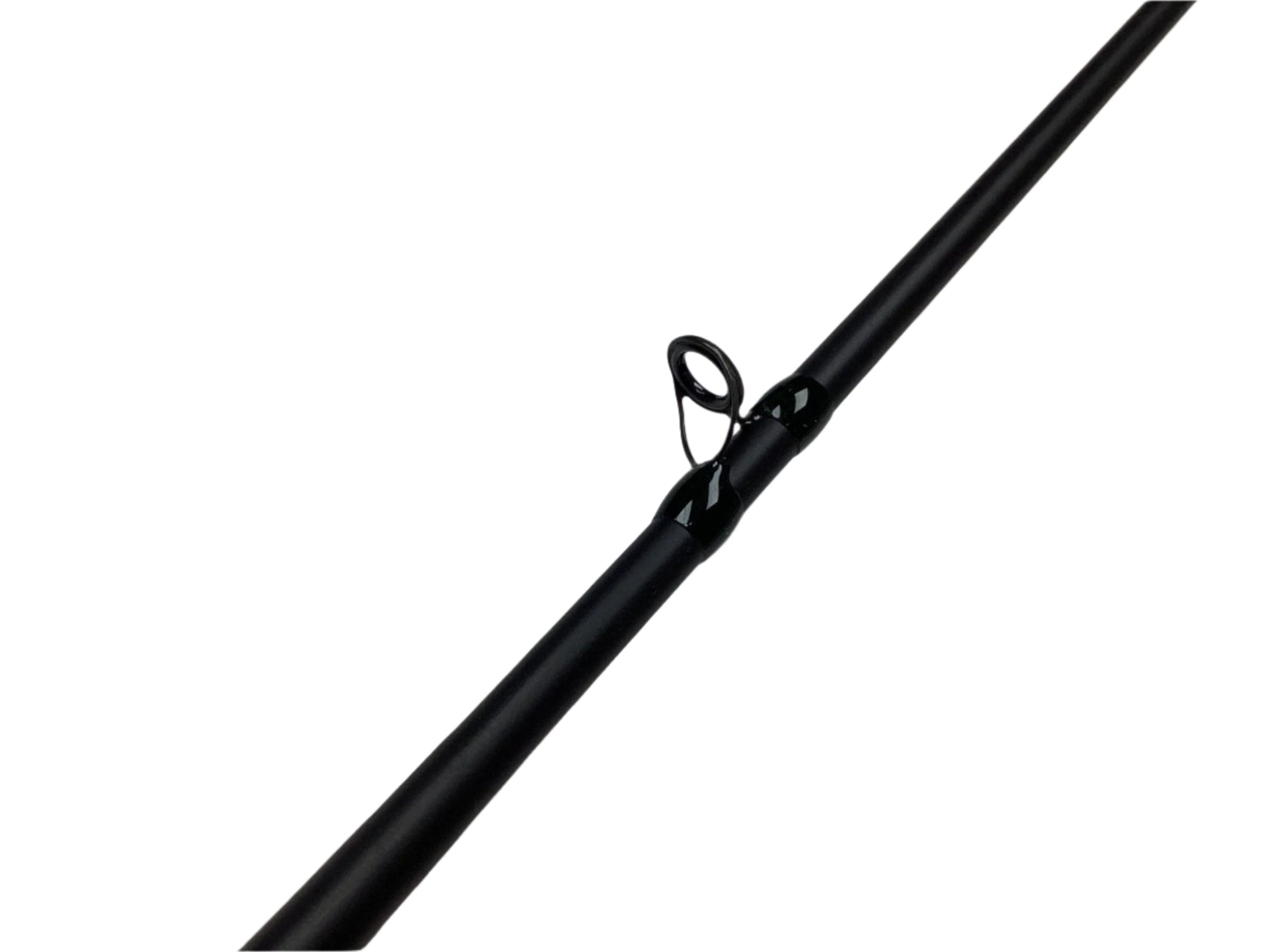 Close-up of a G. Loomis IMX-PRO Steelhead Casting Rod in mint condition on a light surface. The image highlights the glossy, circular line guide, ideal for those joining the Rod and Reel Trade-In Program to earn store credit.