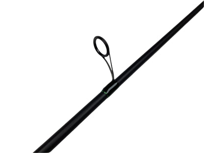 A G. Loomis IMX-PRO Steelhead Bead 1201-2S STBR 10'0" Medium Light spinning rod in mint condition rests on a white surface, showcasing a black finish, metallic guide loop, and green binding.