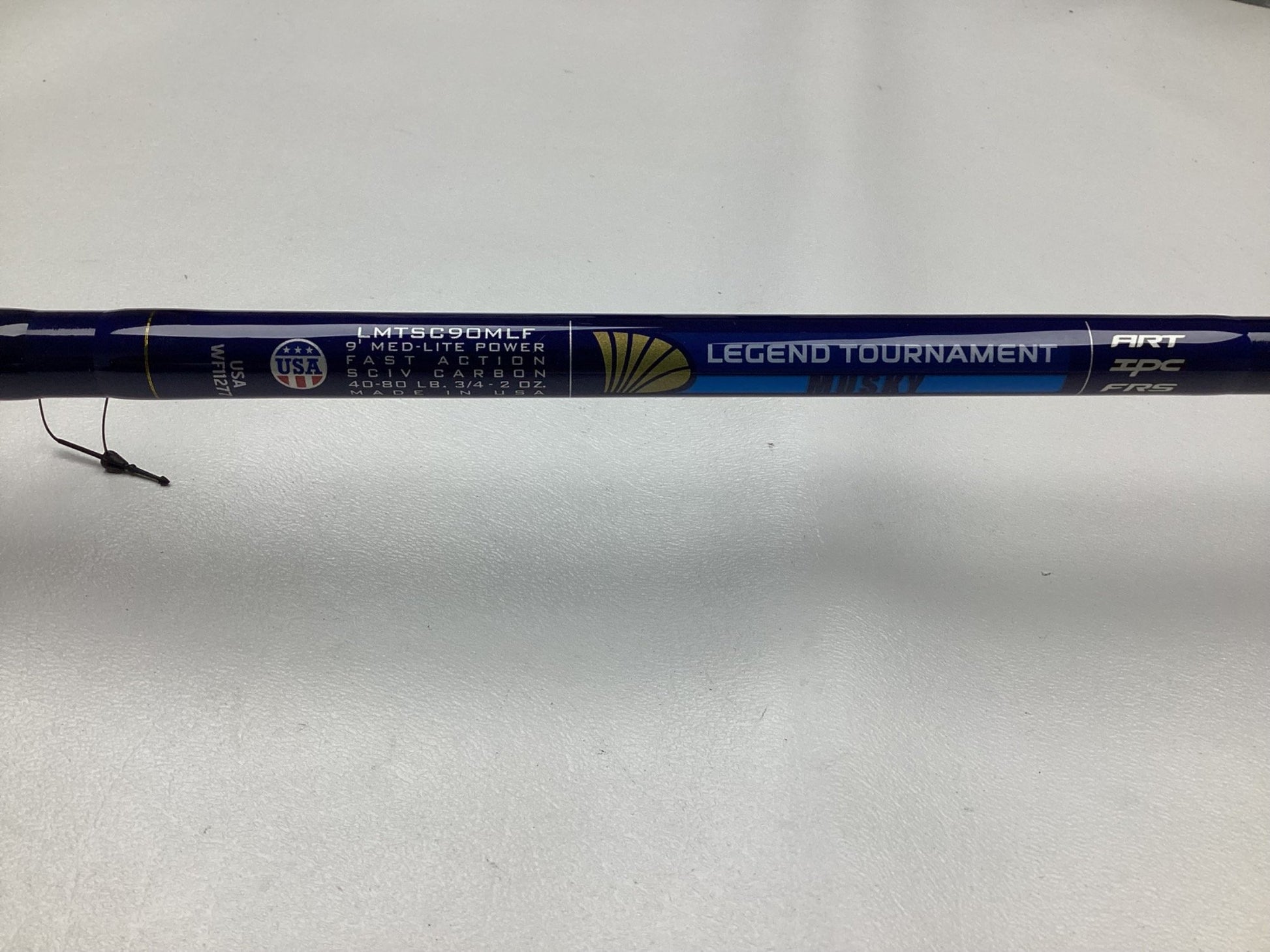 A close-up of a St. Croix Legend Tournament Musky Casting Rod Split Cork 9'0" Medium Light Bantam Bait, in mint used condition, with medium-light power and fast action visible on a light surface.