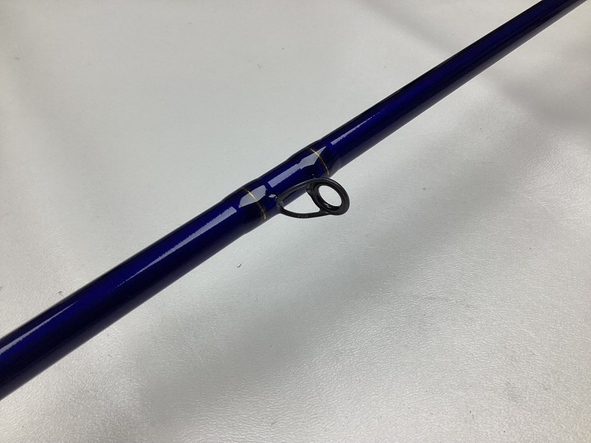 A close-up of the St. Croix Legend Tournament Musky Casting Rod Split Cork 8'6" ML Lil' Dawg, used in mint condition with a black line guide—ideal for quality gear seekers or those considering the Rod and Reel Trade-In program.
