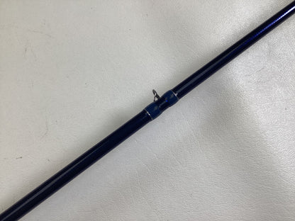 A close-up of a Duckett Jacob Wheeler Select DFWS73M-CC 7'3" Medium Crankin used casting rod in excellent condition with a metal guide ring, ideal for those interested in our Rod and Reel Trade-In Program.