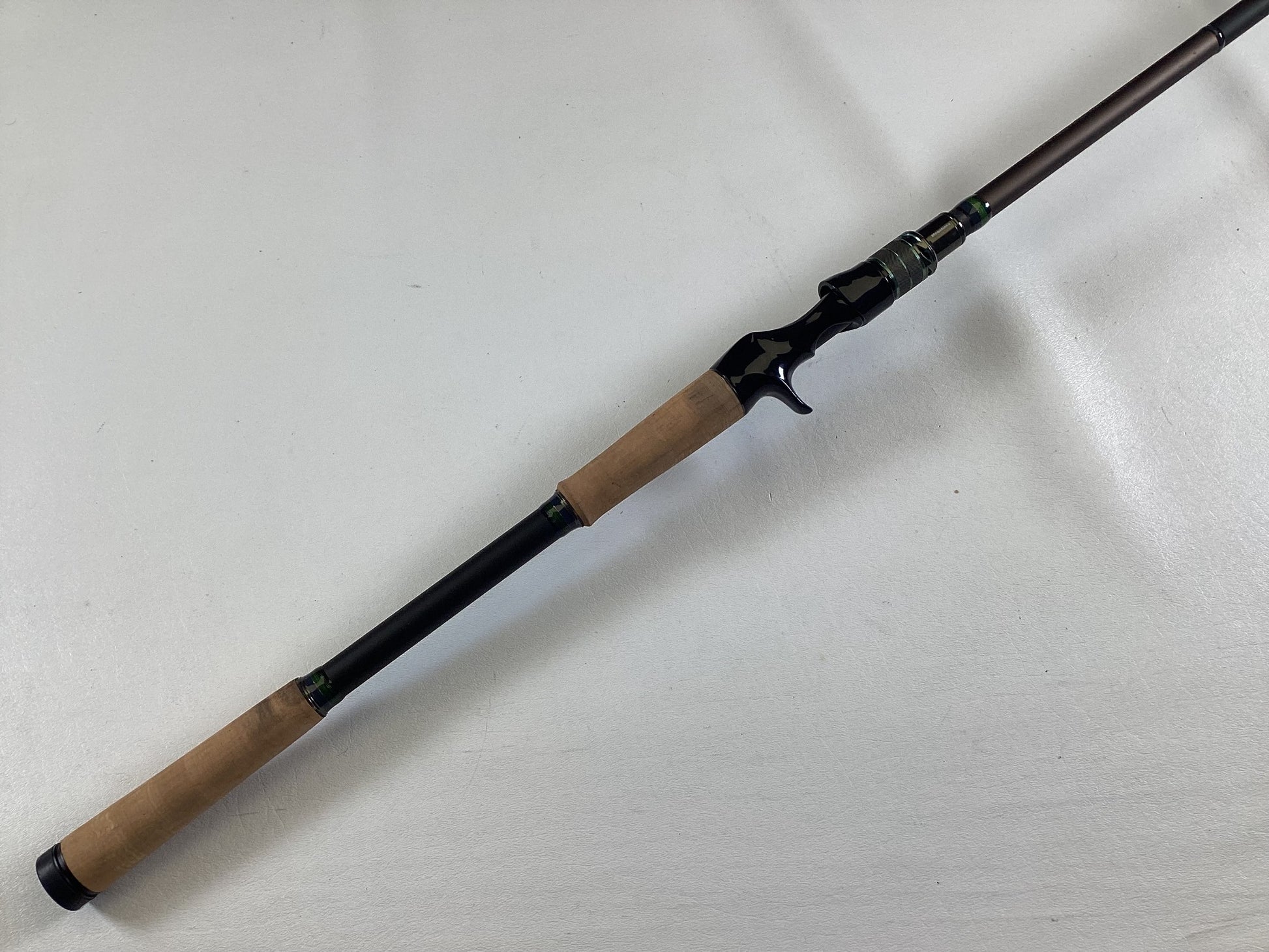 Upgrade with our Rod and Reel Trade-In program or earn store credit on quality gear like this Megabass Orochi X10 F9-710XT Anaconda 7'10" XXH Used Casting Rod in excellent condition, featuring cork handles and a black reel seat.