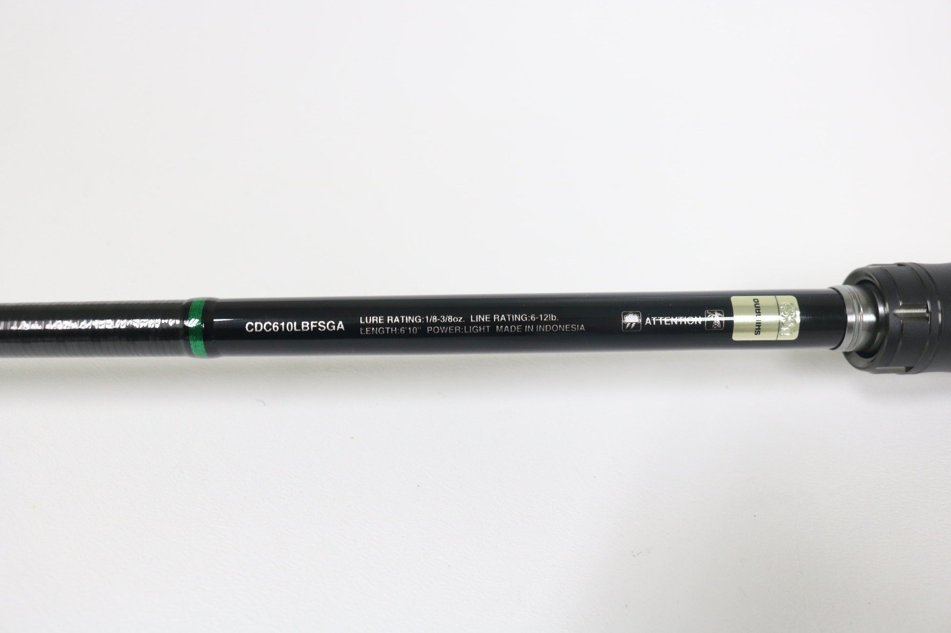 A close-up of a Shimano Curado CDC610LBFSGA 6'10" Light used casting rod in excellent condition, showing model and line rating info in white text and a green band near the handle—ideal for rod and reel trade-in or store credit.
