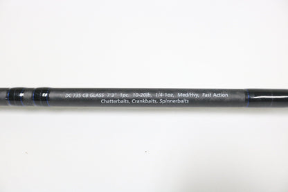 A close-up of a Dobyns Champion XP Series DC 735CB Glass Used Casting Rod in very good condition, showing specs: 7’3”, 10-20lb, 1/4-1oz, Med/Hvy, Fast Action—ideal for used fishing gear or our rod and reel trade-in program.