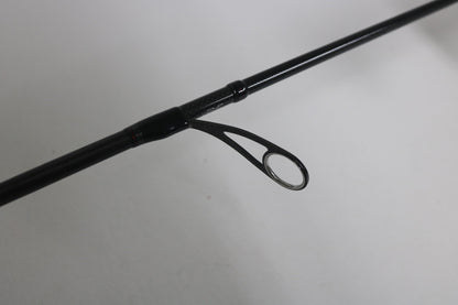 Close-up of the Daiwa Steez AGS spinning rod guide against a plain background. The sleek black design enhances the guide's simplicity. Upgrade your used gear with our Rod and Reel Trade-In Program, and potentially earn store credit for your next adventure.