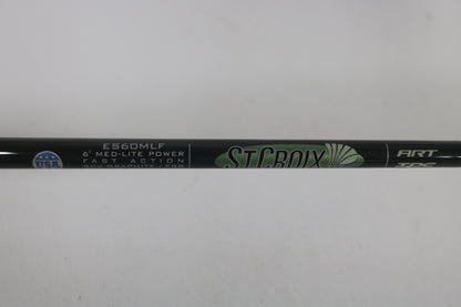 Close-up of a St. Croix Legend Elite ES60MLF 6'0" Medium Light used spinning rod in mint condition, featuring "ST. CROIX" branding, SCV Graphite FRS, part of our Rod and Reel Trade-In Program. USA flag emblem shown.