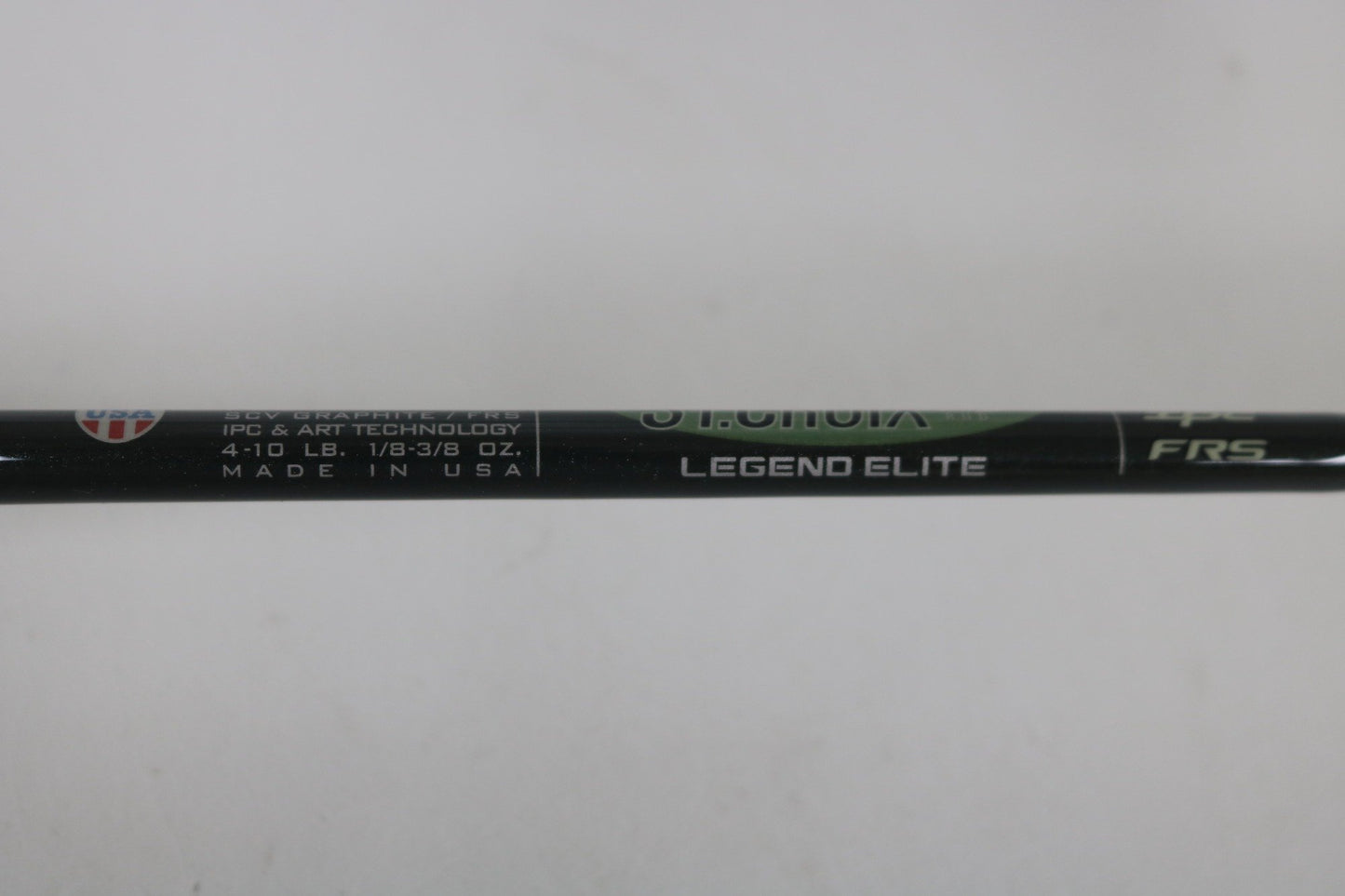 Close-up of a St. Croix Legend Elite ES60MLF 6'0" Medium Light used spinning rod in mint condition, showing "LEGEND ELITE," "IPC & ART TECHNOLOGY," and "MADE IN USA." Eligible for Rod and Reel Trade-In: earn store credit. Specs: 4-10 LB, 1/8-3/8 OZ.