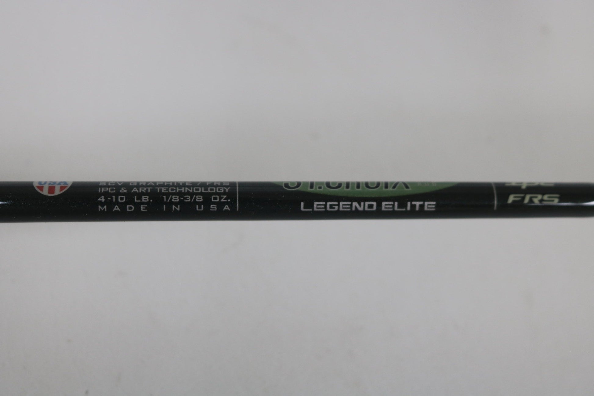Close-up of a St. Croix Legend Elite ES60MLF 6'0" Medium Light used spinning rod in mint condition, showing "LEGEND ELITE," "IPC & ART TECHNOLOGY," and "MADE IN USA." Eligible for Rod and Reel Trade-In: earn store credit. Specs: 4-10 LB, 1/8-3/8 OZ.