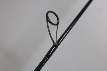 Close-up of a St. Croix Legend Elite ES60MLF 6'0" Medium Light used spinning rod guide—metal ring and support visible, ideal for those interested in upgrading with our Rod and Reel Trade-In Program. Mint condition from St. Croix.