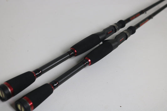 Two Damiki Dark Angel C701MH and C701M casting rods in good used condition are shown side by side, perfect for upgrading through our Rod and Reel Trade-In Program.