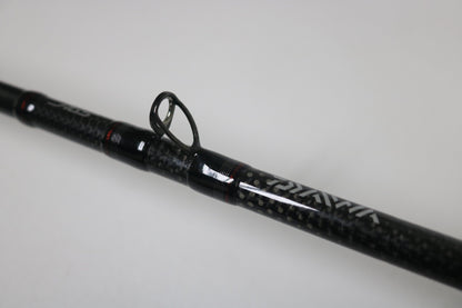 Close-up of a Daiwa Steez AGS STAGS741XHFB used casting rod in excellent condition, featuring a black finish, visible line guide, and textured grip against a plain white background.