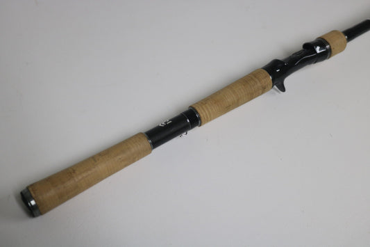 The Daiwa BLX BLXLG741MHRB 7'4" Medium Heavy Used Casting Rod in excellent condition is shown on a plain white surface—perfect for those interested in our Rod and Reel Trade-In Program or earning store credit for quality used gear.