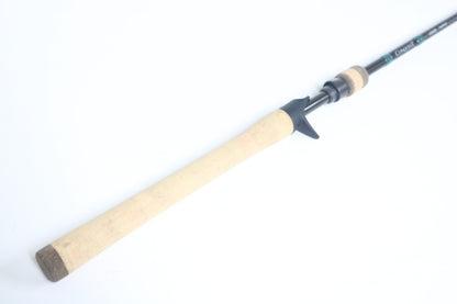 A G. Loomis Conquest CNQ 843C MBR Used Casting Rod in mint condition, shown with a cork handle and black reel seat—ideal for trading in through our Rod and Reel Trade-In Program to upgrade your gear and earn store credit.