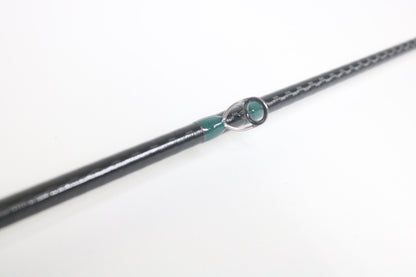 A close-up of the G. Loomis Conquest CNQ 843C MBR Used Casting Rod in mint condition highlights its quality—perfect for showcasing premium pre-owned G. Loomis gear available through our Rod and Reel Trade-In Program for store credit.