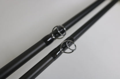 Close-up of two Temple Fork TFO Tactical Bass TAC SB 726-1 and TAC SC 746-1 casting rods (used, good condition), showing metal line guides—ideal for anglers seeking quality pre-owned gear or trade-in store credit.