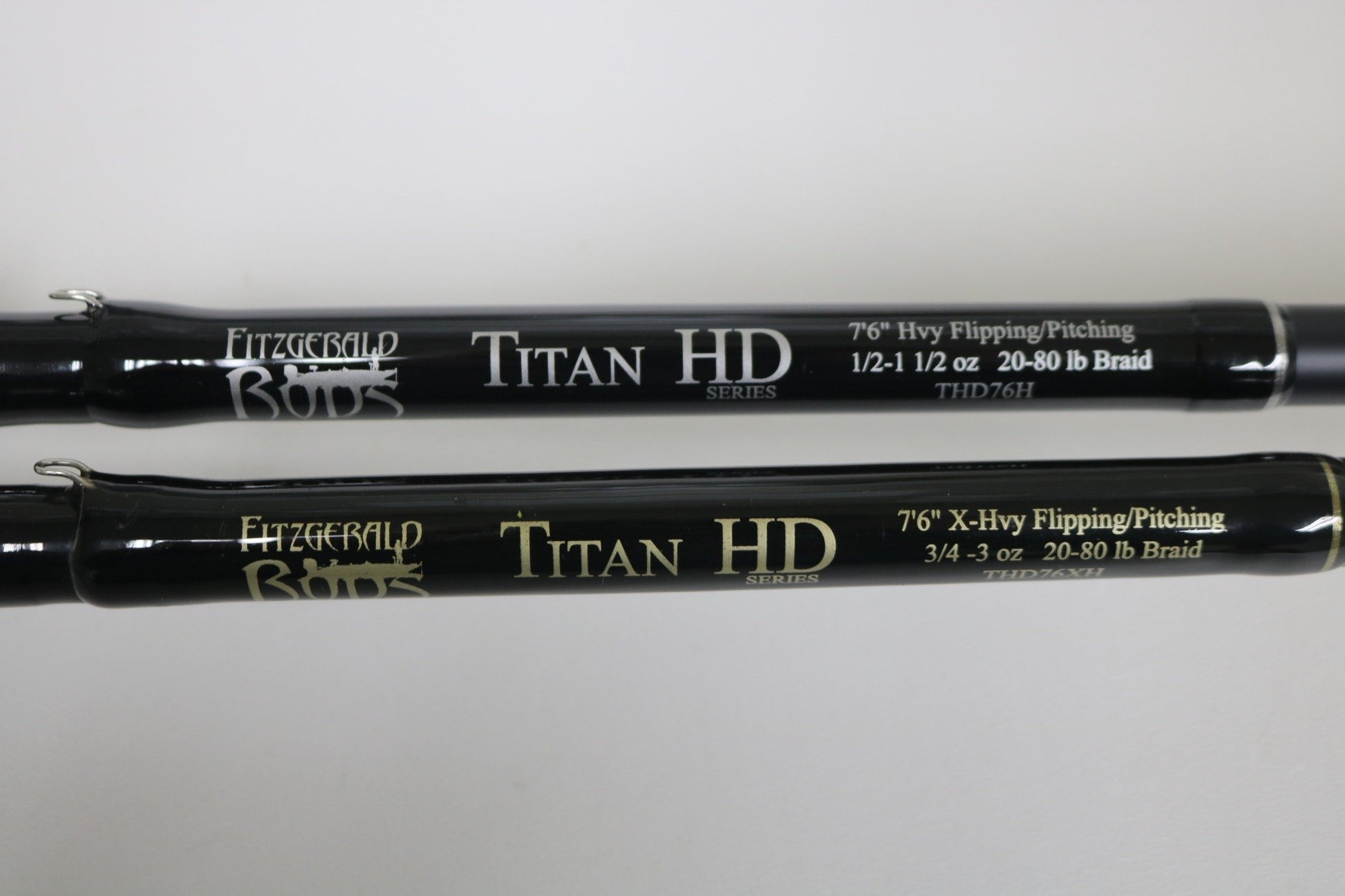 Two Fitzgerald Titan HD THD76H & THD76XH Casting Rods (7'6", heavy & extra-heavy, black) in Used - Very Good Condition. Ideal for Rod and Reel Trade-In or redeeming Store Credit on your next upgrade.