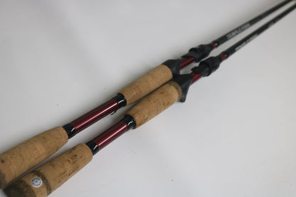 Two Temple Fork GTS Bass C735-1 and TPM CB 745-1 casting rods in good used condition are displayed side by side, eligible for store credit through our Rod and Reel Trade-In Program.
