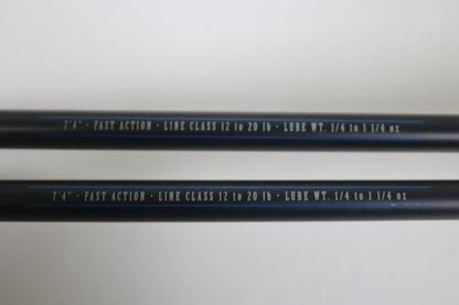Two black Mustad BLF Instinct 7'4" Medium Heavy Casting Rods (used, very good) feature white text specs on the shafts—ideal for those trading in used gear through the Nation's Best Rod and Reel Trade-In Program.
