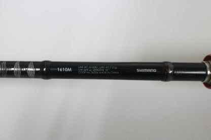 A close-up of the Shimano Zodias ZDC610MA 6'10" Medium Used Casting Rod—Very Good Condition—on a white surface, ideal for upgrading through our Rod and Reel Trade-In Program and earning store credit for your used Shimano gear.