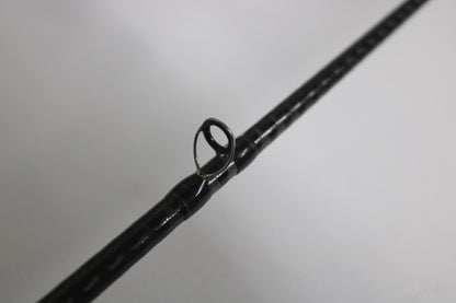 Close-up of a Shimano Zodias ZDC610MA 6'10" Medium Used Casting Rod in very good condition, highlighting one line guide against a plain background—ideal for our Rod and Reel Trade-In Program.