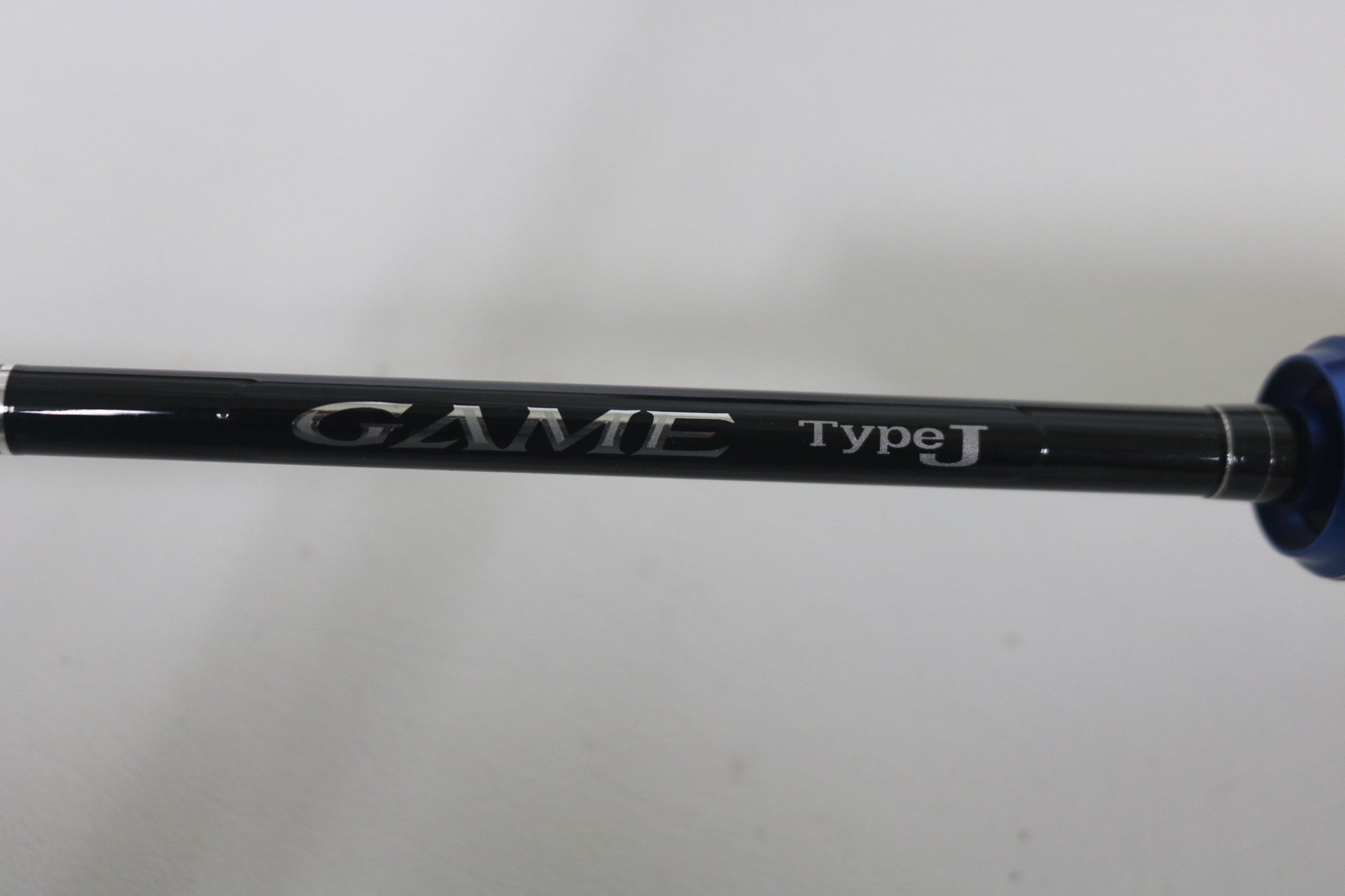 Close-up of the Shimano Game Type J 6'0" Used Casting Rod in excellent condition, showing "GAME type J" in silver—ideal for our Rod and Reel Trade-In Program where you can earn store credit for quality used Shimano gear.